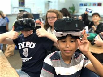 Students using Virtual Reality goggles. 